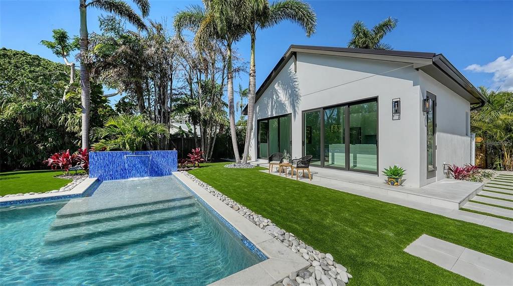 5035 Bay Shore Road Sarasota, FL 34234 - Photo 56 of 84 a view of a house with a yard