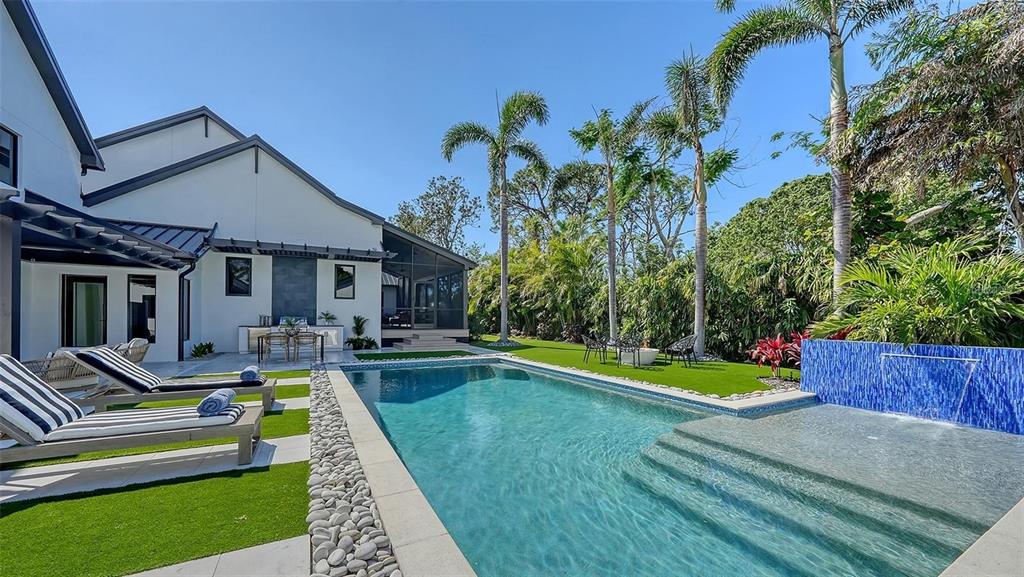 5035 Bay Shore Road Sarasota, FL 34234 - Photo 6 of 84 a view of a house with swimming pool and a yard