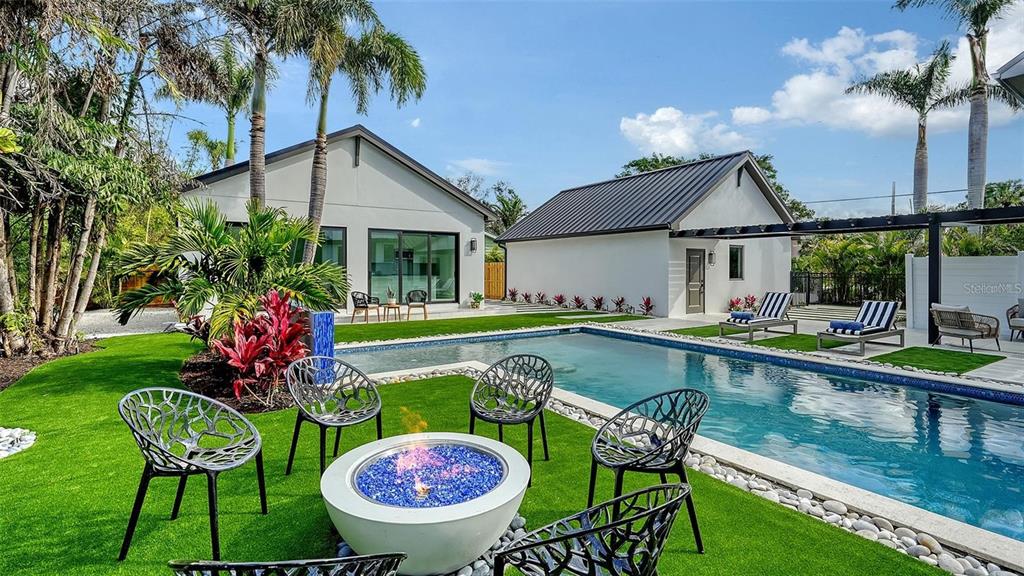 5035 Bay Shore Road Sarasota, FL 34234 - Photo 64 of 84 a view of house with swimming pool yard and outdoor seating