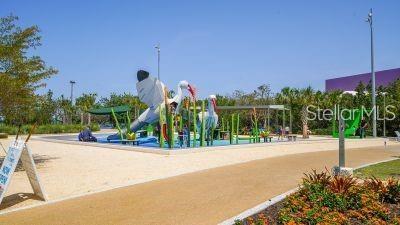 5035 Bay Shore Road Sarasota, FL 34234 - Photo 78 of 84 a front view of a house with palm trees