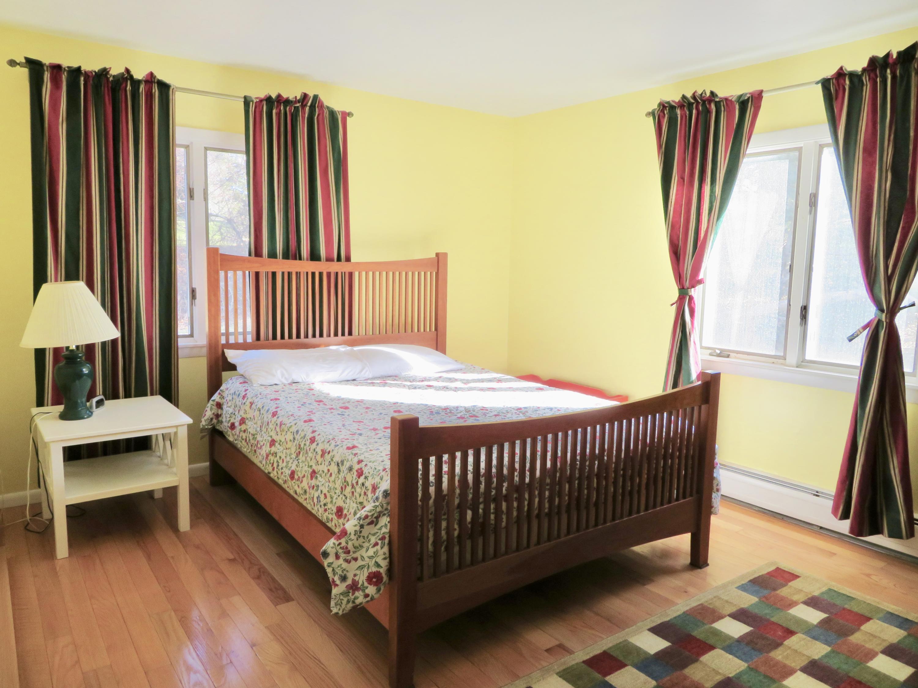 111 Elgin Road Pocasset, MA 02559 - Photo 13 of 34 a bedroom with a bed and a window