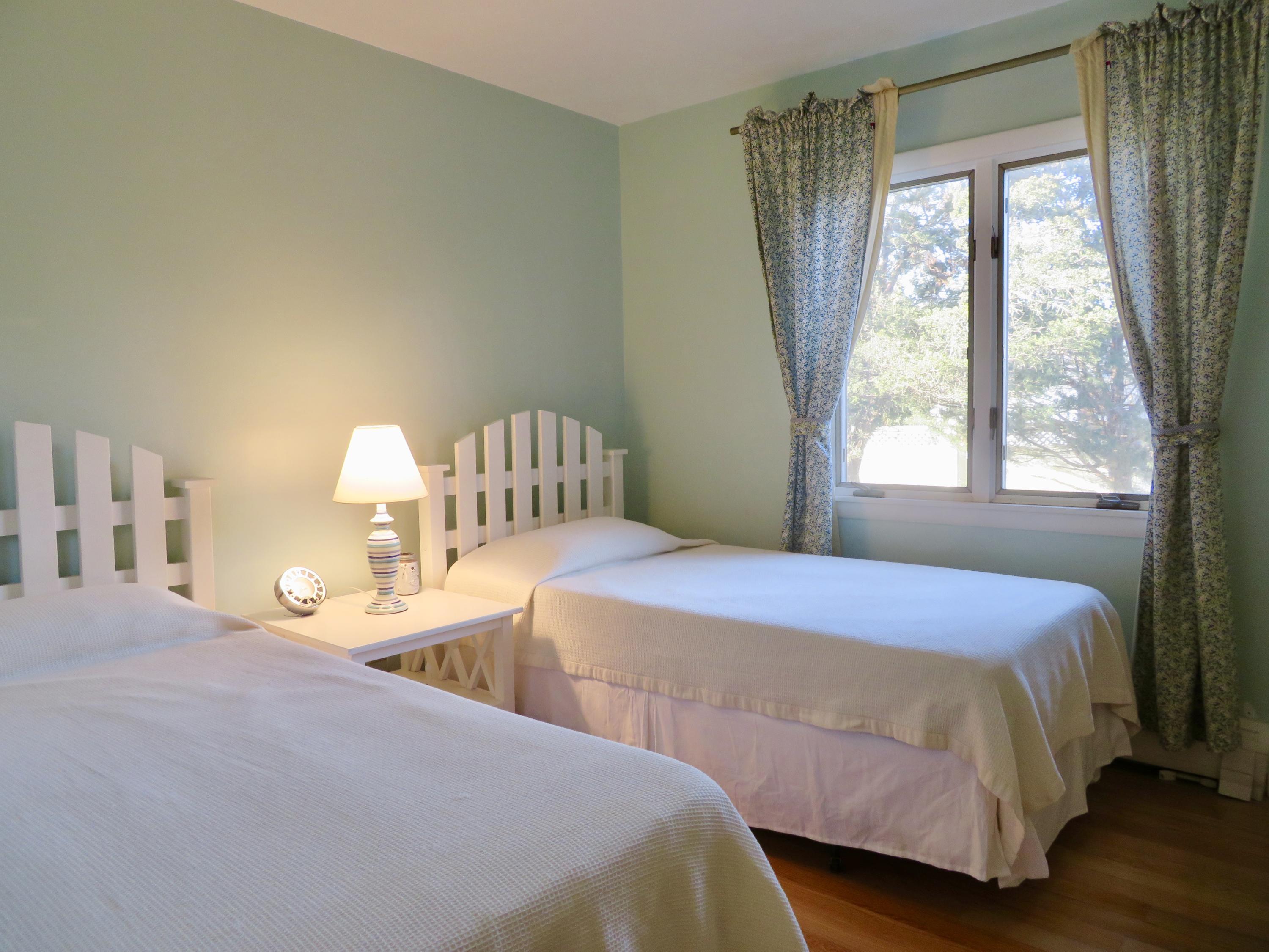 111 Elgin Road Pocasset, MA 02559 - Photo 15 of 34 a bedroom with a bed and a large window