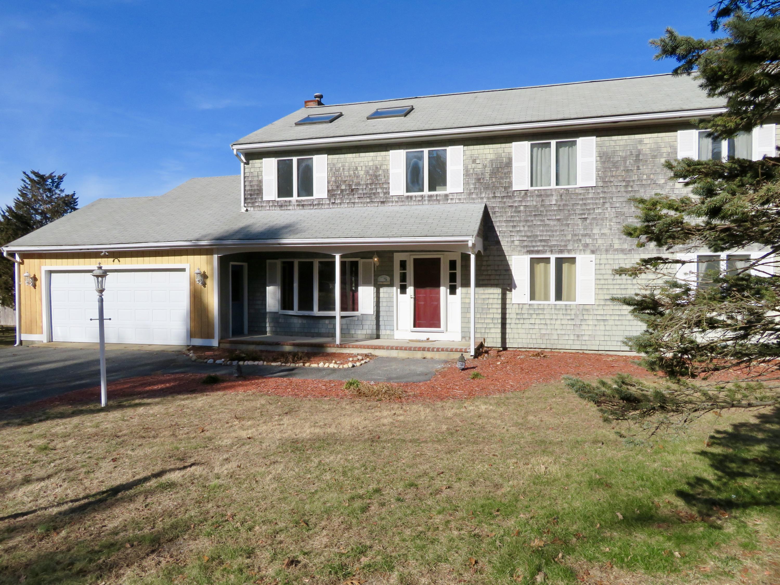 111 Elgin Road Pocasset, MA 02559 - Photo 2 of 34 a front view of a house with yard
