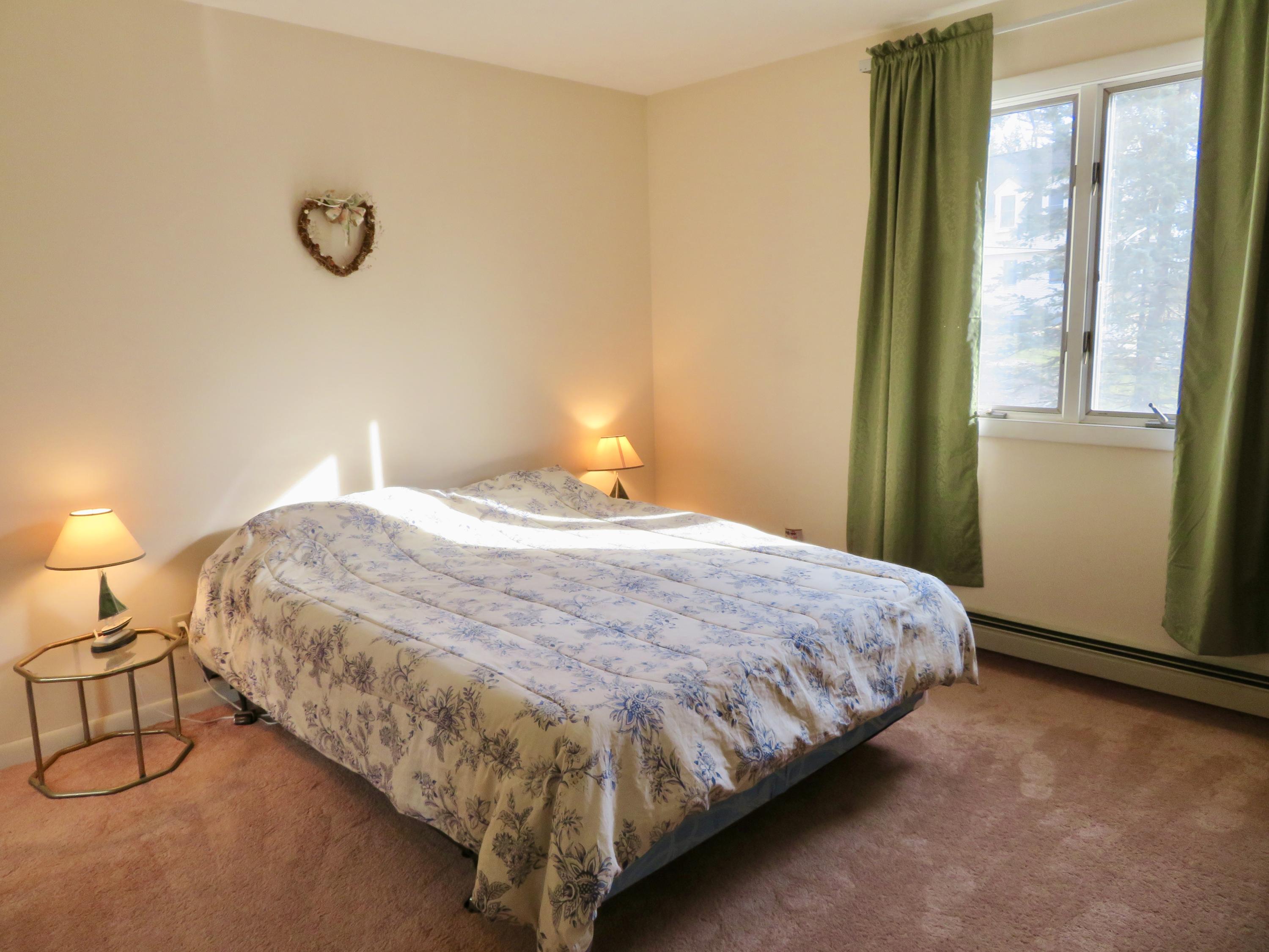 111 Elgin Road Pocasset, MA 02559 - Photo 24 of 34 a bedroom with a bed and a window