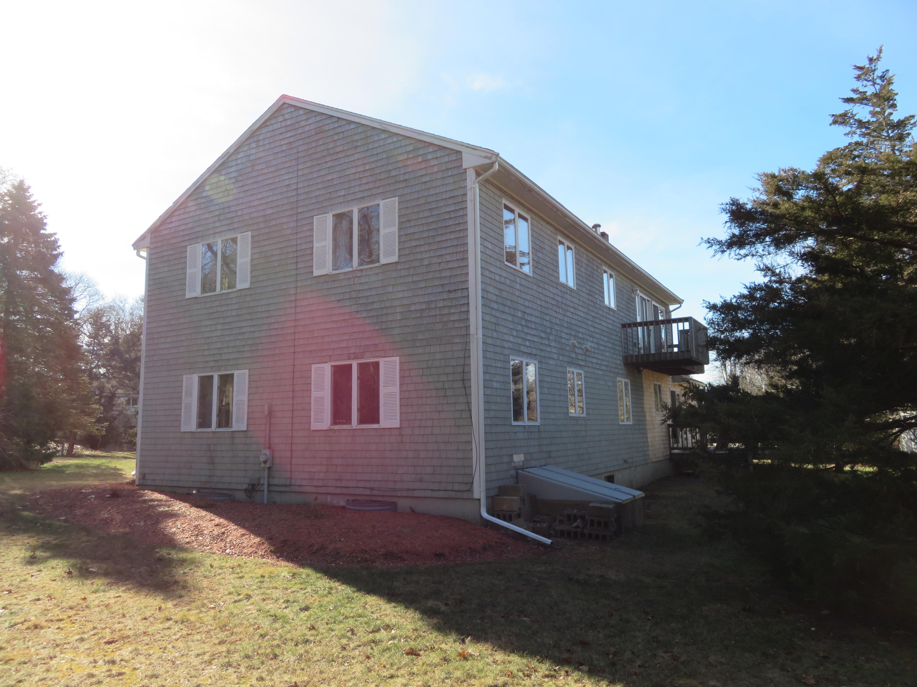111 Elgin Road Pocasset, MA 02559 - Photo 27 of 34 a front view of a house with a yard