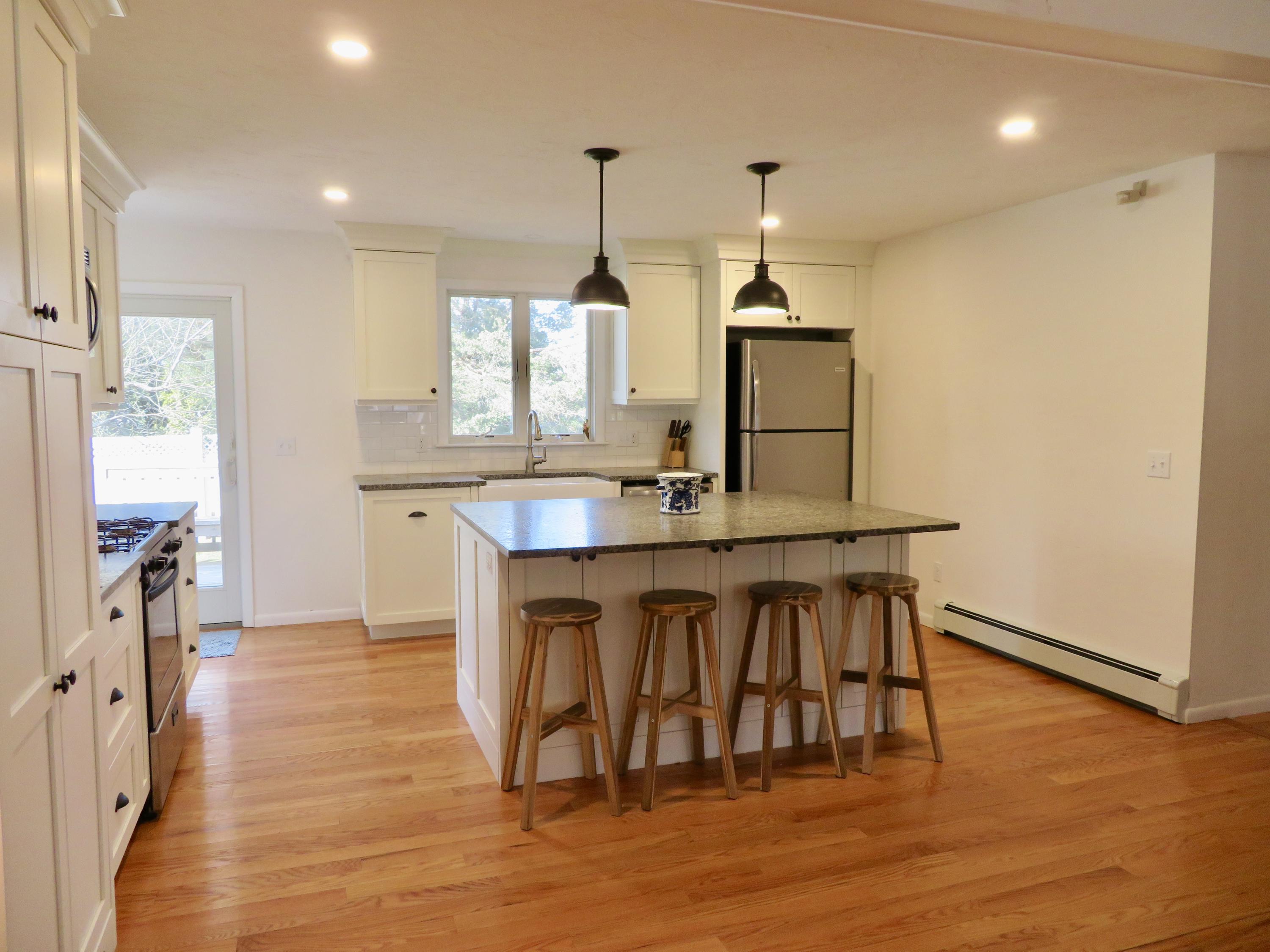 111 Elgin Road Pocasset, MA 02559 - Photo 7 of 34 a kitchen with a sink cabinets and window