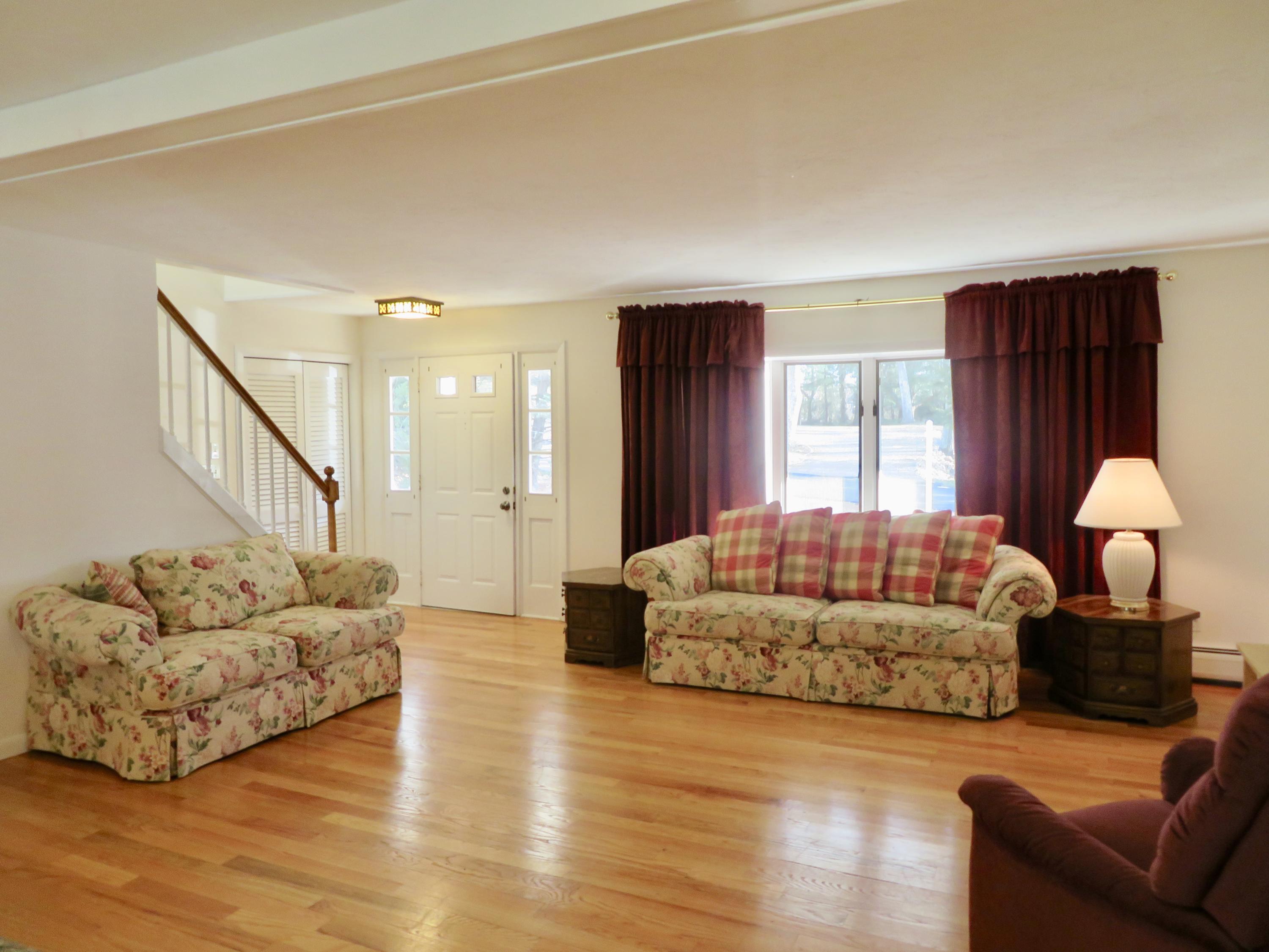 111 Elgin Road Pocasset, MA 02559 - Photo 8 of 34 a living room with furniture window and a couch
