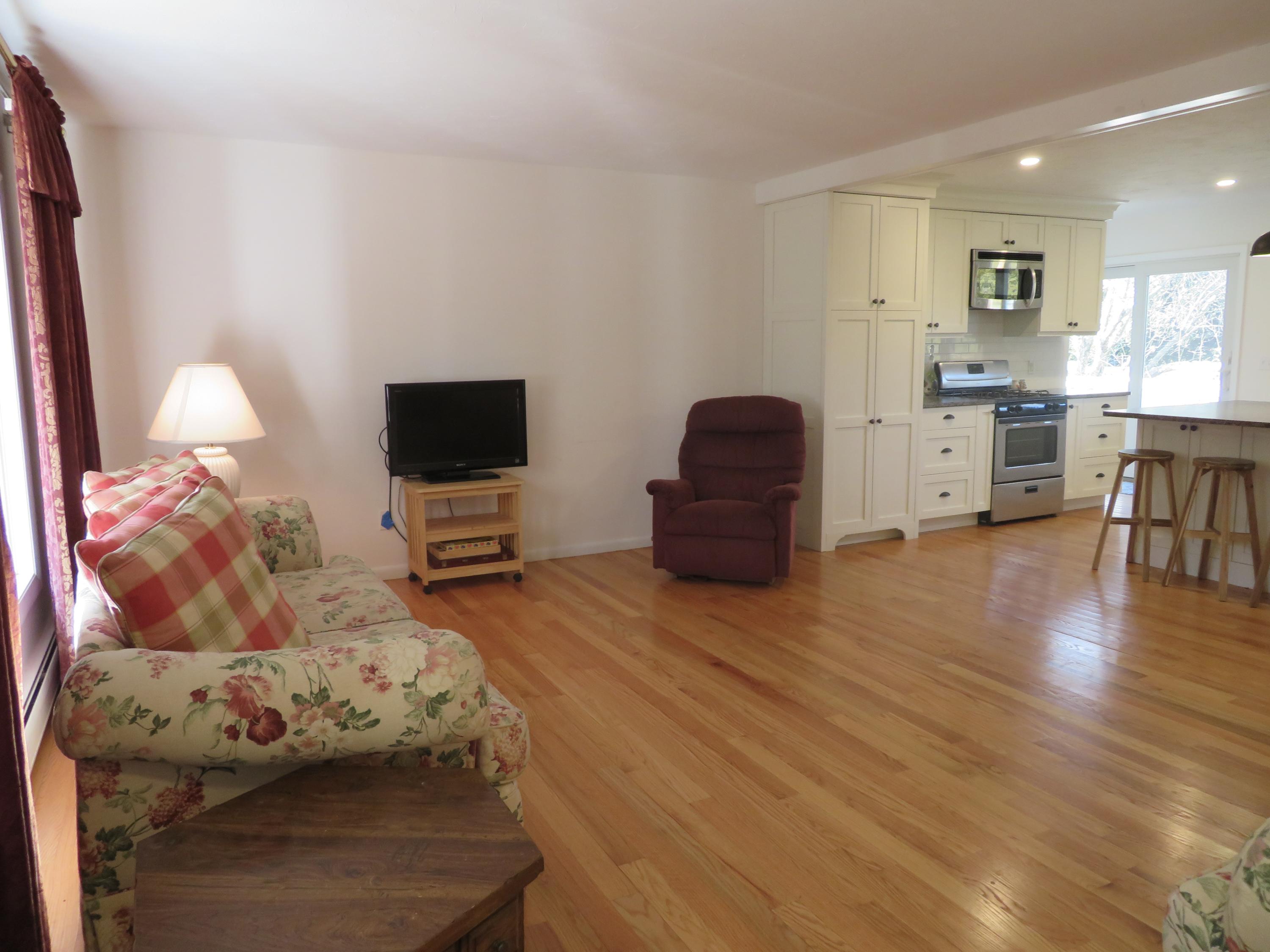 111 Elgin Road Pocasset, MA 02559 - Photo 10 of 34 a bedroom with furniture and a flat screen tv