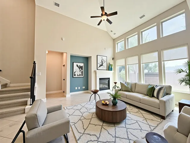 a living room with furniture and a large window