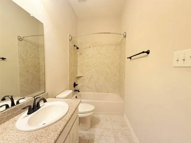 a view of a hallway with wooden floor and entryway