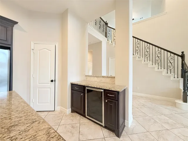 a view of a living room and kitchen