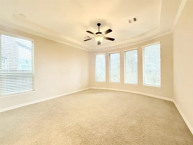 a large bathroom with a sink mirror and a bathtub