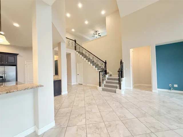 a view of entryway and hall with dining room
