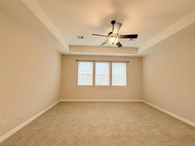 a view of hallway with windows