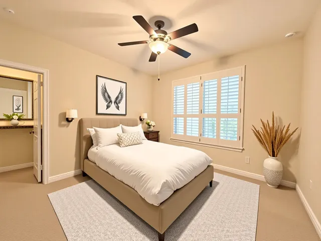 an empty room with ceiling fan and window