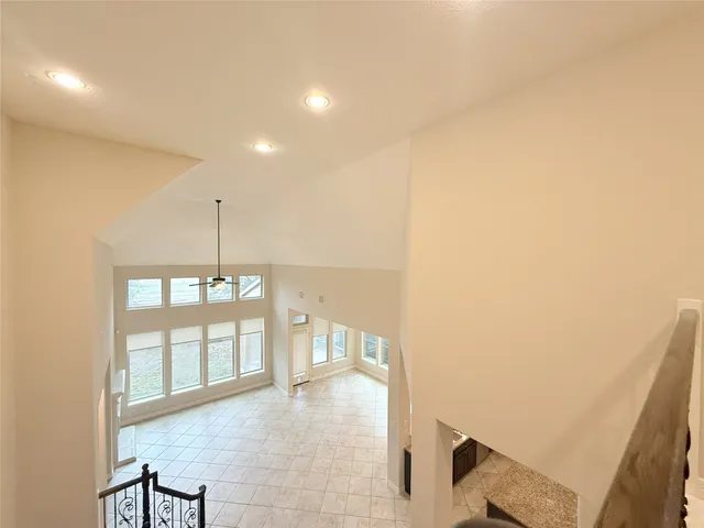 a view of a swimming pool with a yard and a fountain