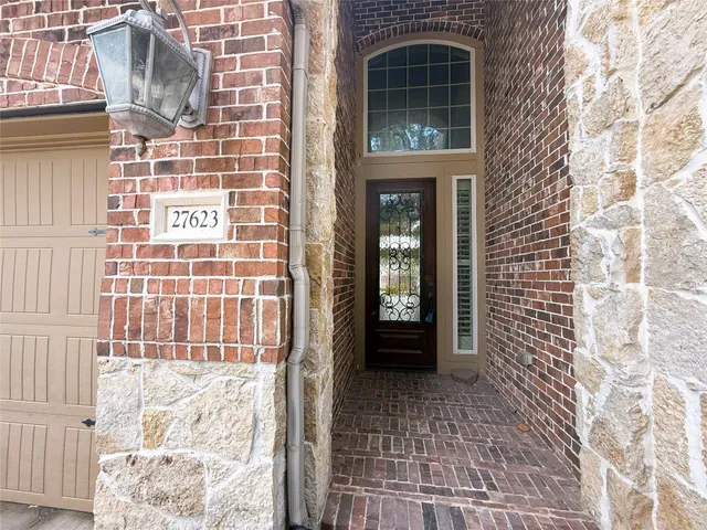 a view of an entryway with wooden floor
