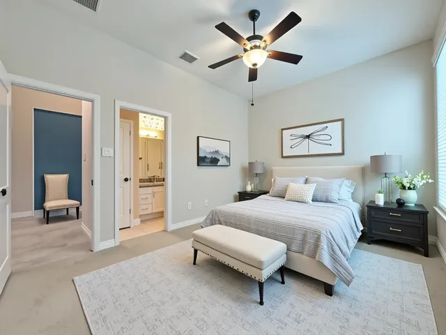 an empty room with closet and a chandelier fan