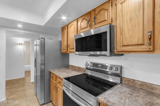 a kitchen with a stove and a microwave