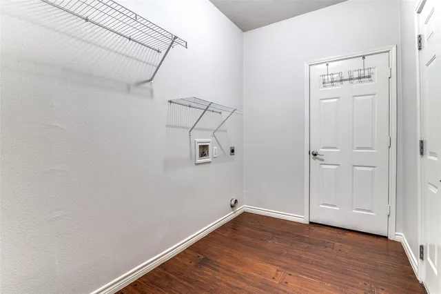 a view of a room with wooden floor