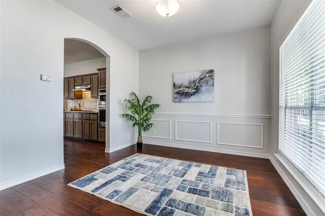 a view of an entryway with wooden floor