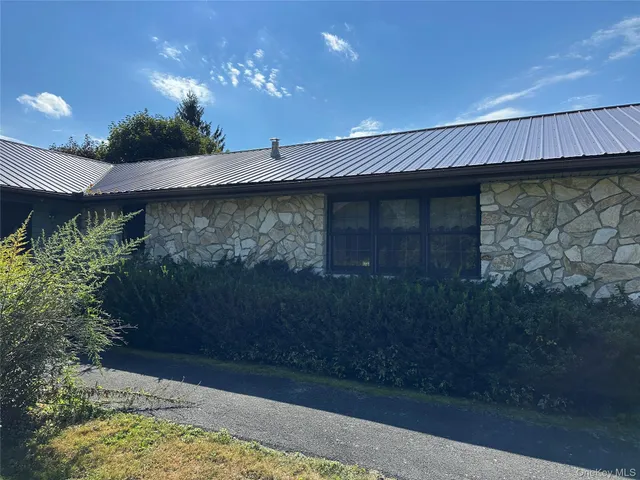 a view of a building with glass door