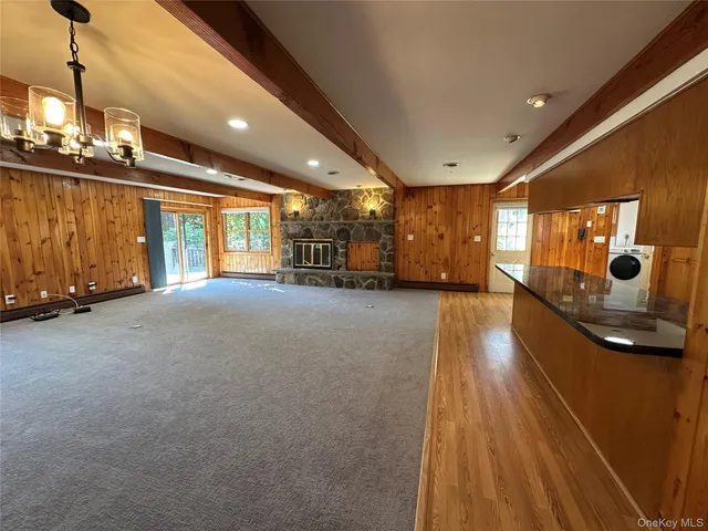 a open kitchen with stainless steel appliances granite countertop a refrigerator stove top oven and sink