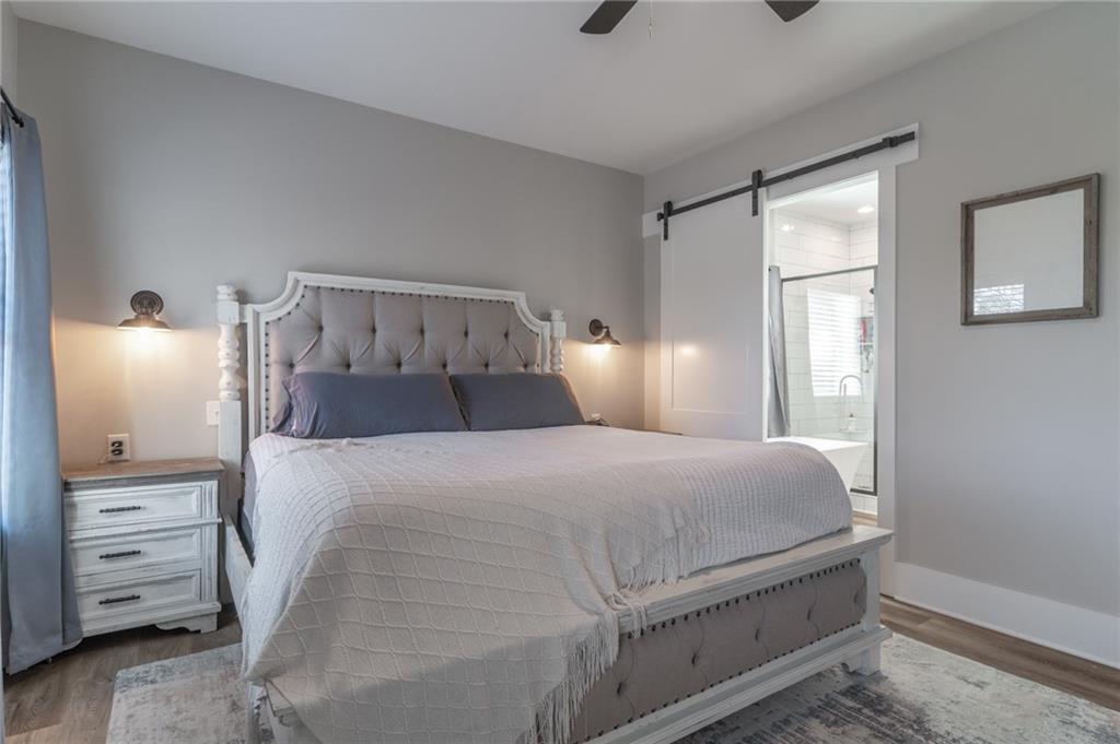 2250 Sperin Road Ball Ground, GA 30107 - Photo 24 of 56 a bedroom with a bed and a window