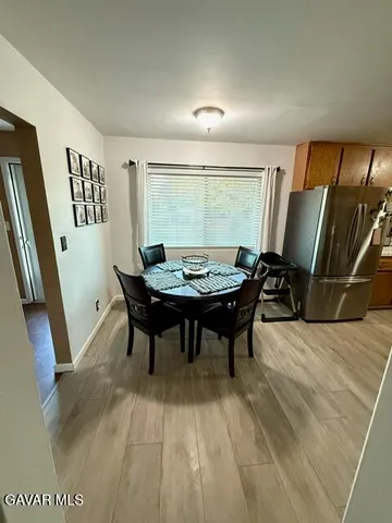 a view of a living room with furniture and a flat screen tv