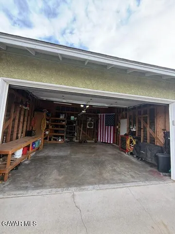 a view of a garage with gym equipment
