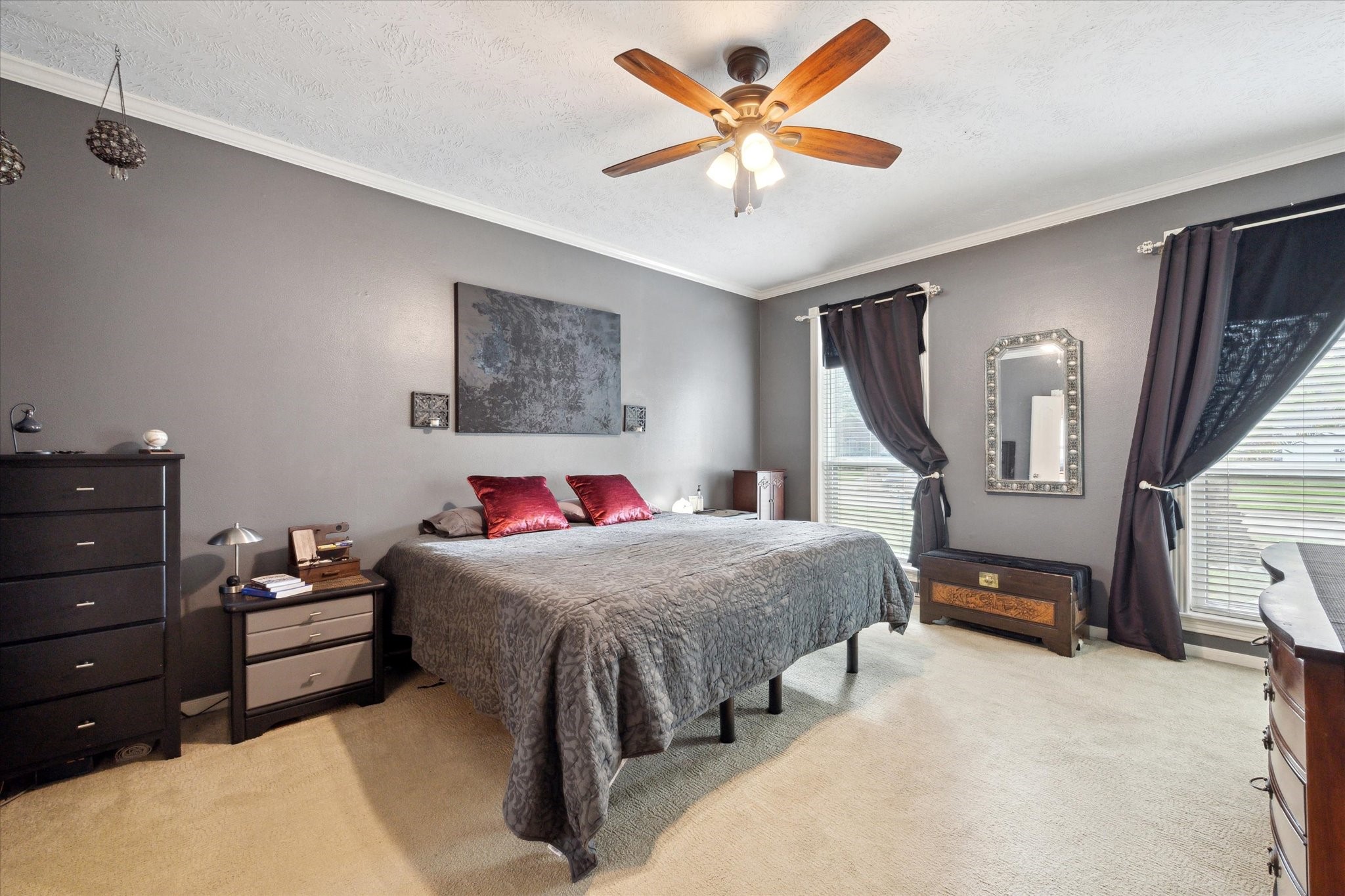 2326 Pin Hook Court Seabrook, TX 77586 - Photo 14 of 42 a bedroom with a bed and a chandelier