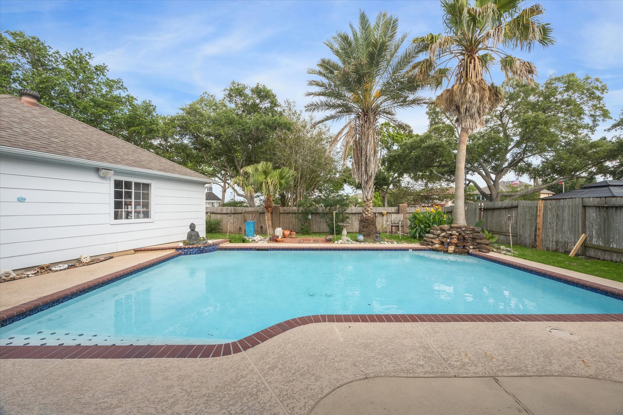 2326 Pin Hook Court Seabrook, TX 77586 - Photo 29 of 42 THE HUGE POOL WITH ROCK WATERFALL AND SPRAYER IS READY TO ENJOY THIS SUMMER!