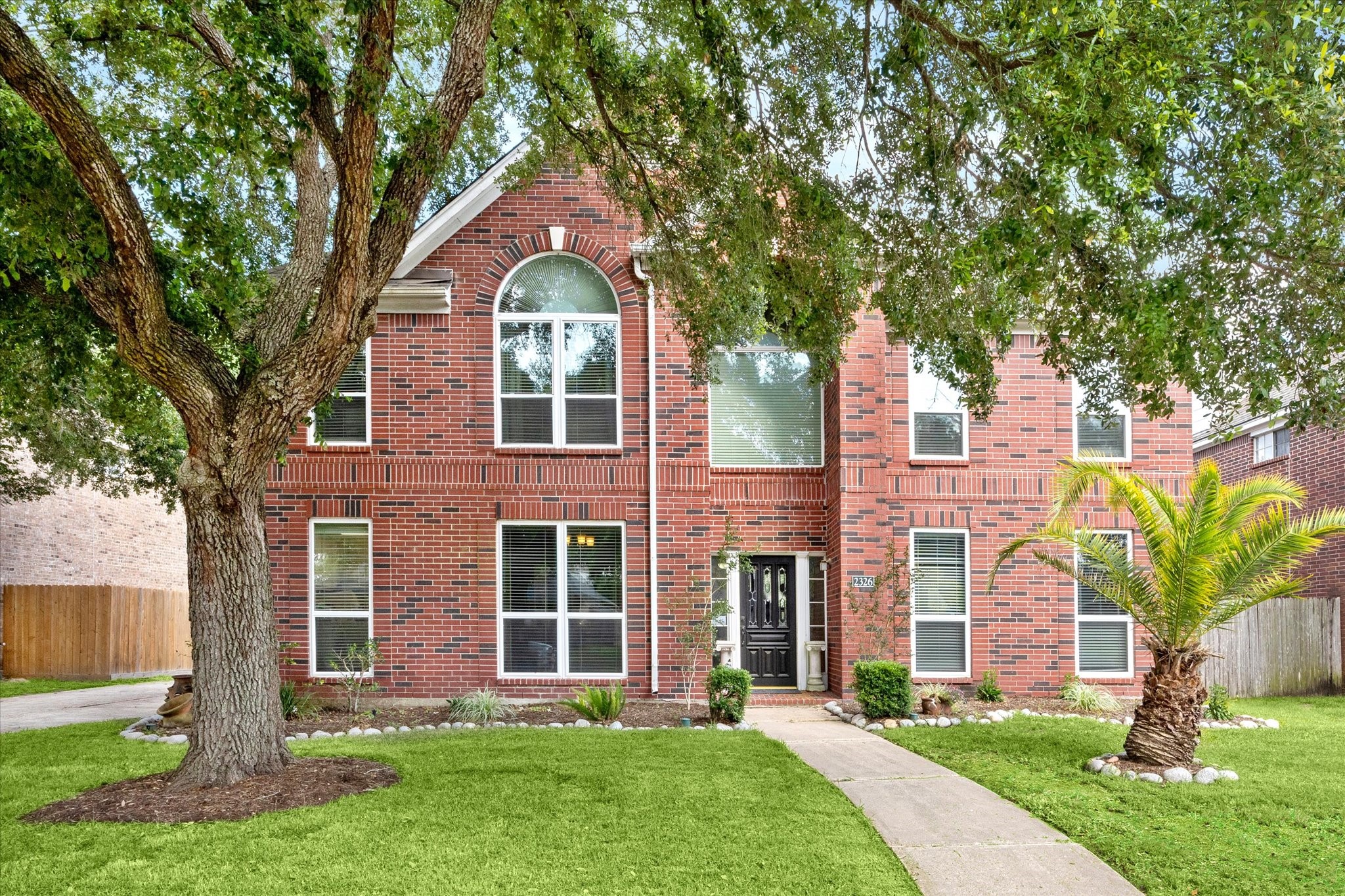 2326 Pin Hook Court Seabrook, TX 77586 - Photo 3 of 42 front view of a house with a yard