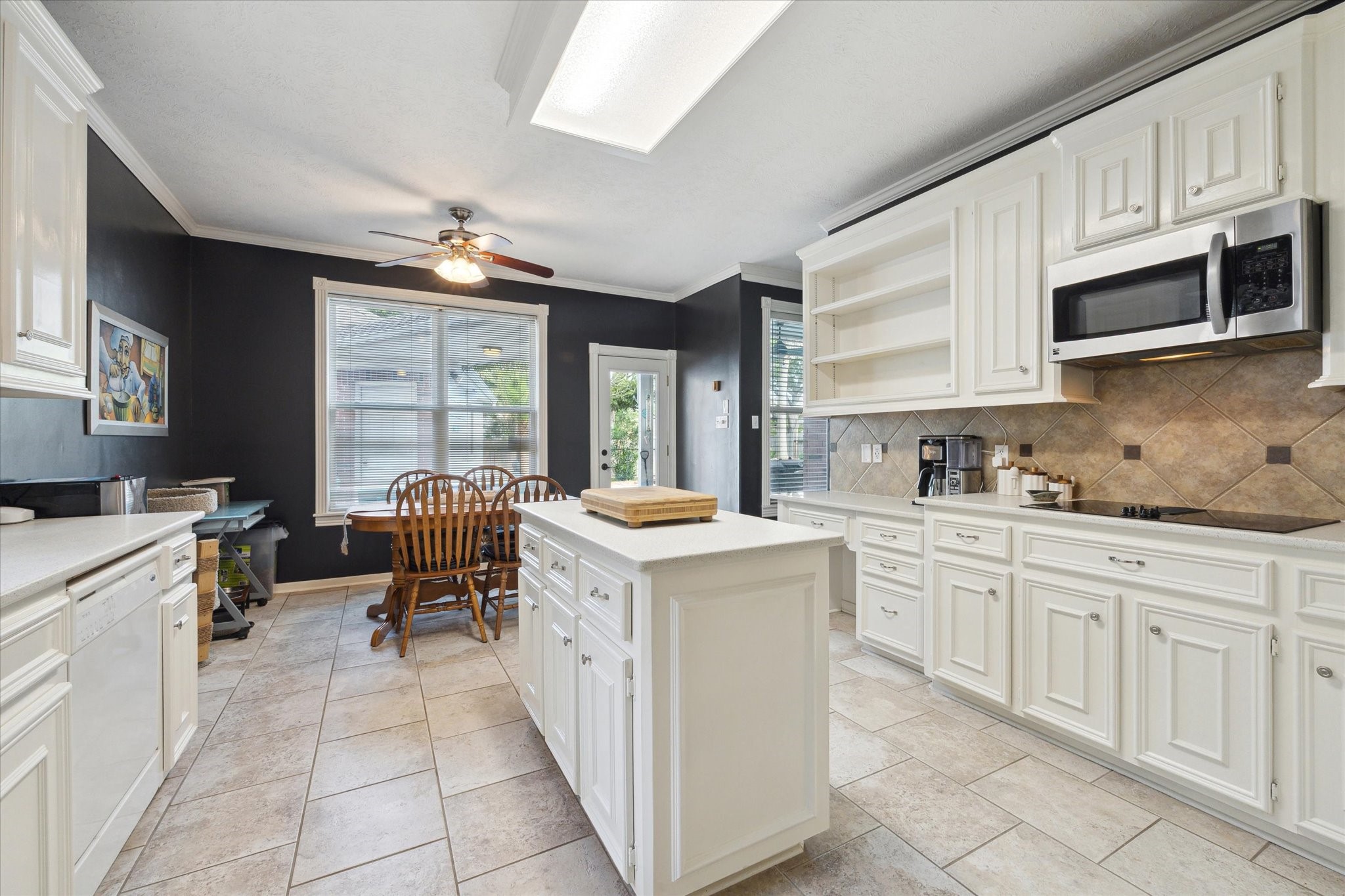 2326 Pin Hook Court Seabrook, TX 77586 - Photo 6 of 42 a kitchen with granite countertop a sink stove and cabinets