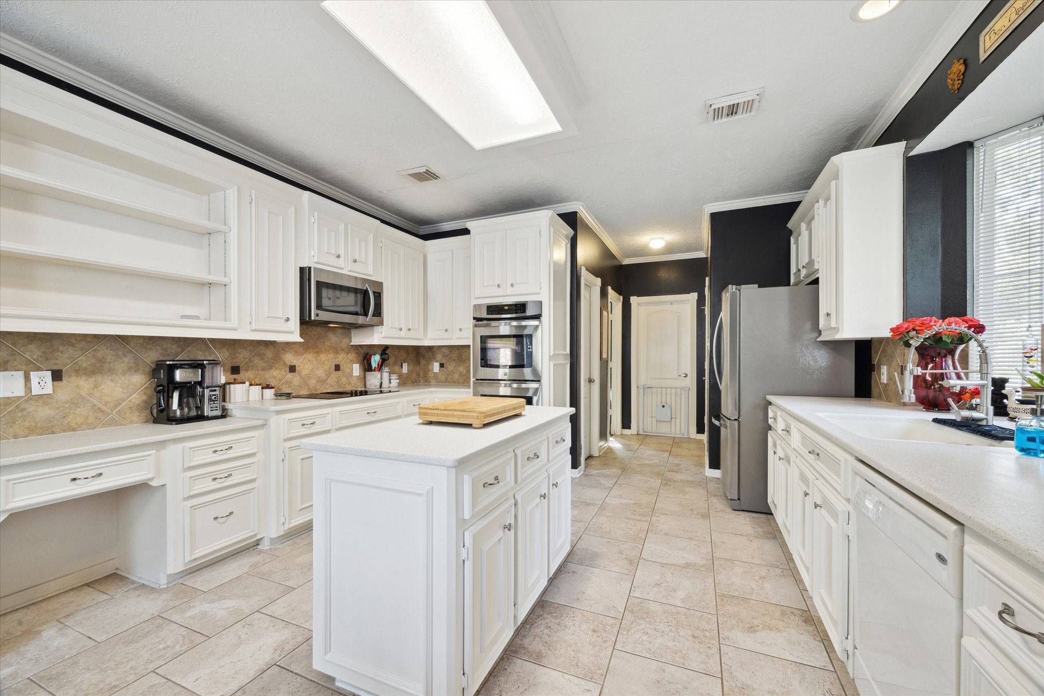 2326 Pin Hook Court Seabrook, TX 77586 - Photo 9 of 42 a kitchen with a sink stove and cabinets