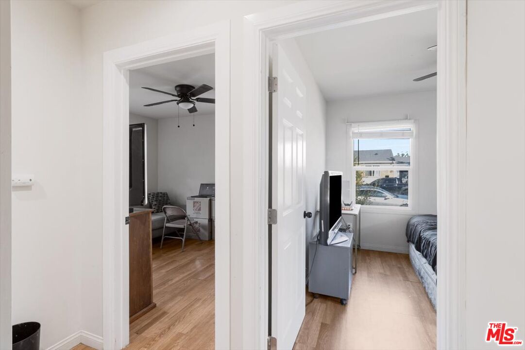 1206 West Magnolia Street Compton, CA 90220 - Photo 14 of 40 a view of a hallway with couch and closet
