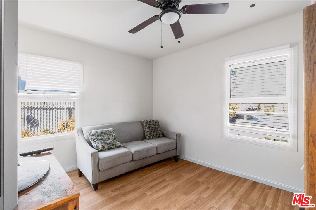 1206 West Magnolia Street Compton, CA 90220 - Photo 19 of 40 a living room with furniture and a window