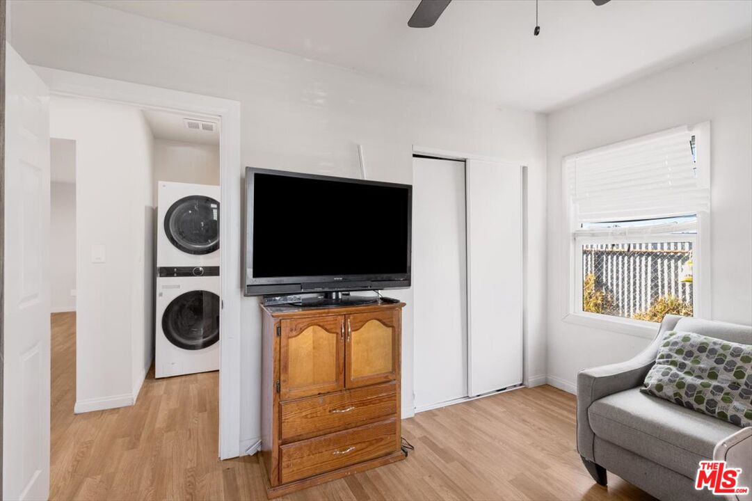 1206 West Magnolia Street Compton, CA 90220 - Photo 21 of 40 a living room with furniture and a flat screen tv