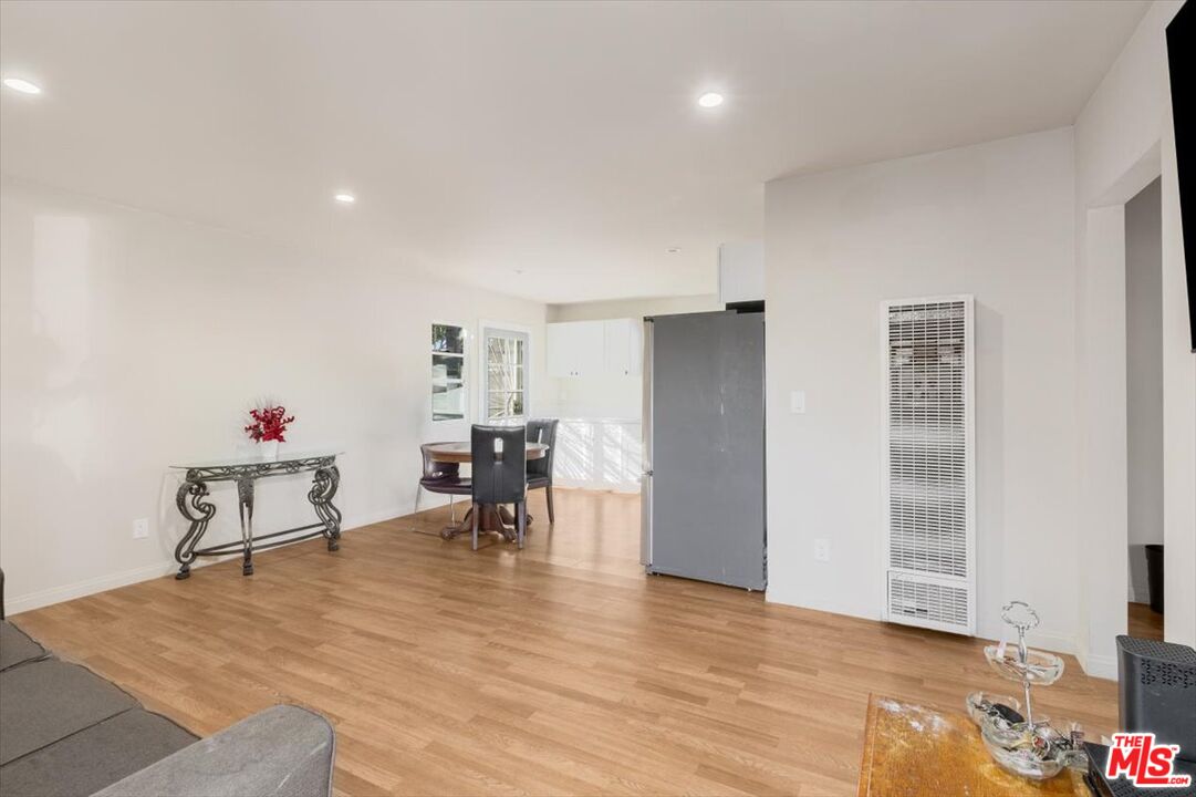 1206 West Magnolia Street Compton, CA 90220 - Photo 3 of 40 a living room with furniture and a table