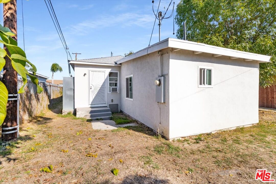 1206 West Magnolia Street Compton, CA 90220 - Photo 32 of 40 a view of a house with a snow in the background
