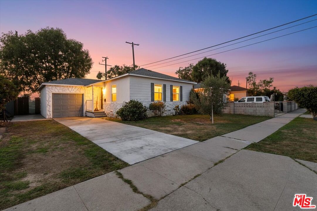 1206 West Magnolia Street Compton, CA 90220 - Photo 40 of 40 a front view of a house with a yard and trees