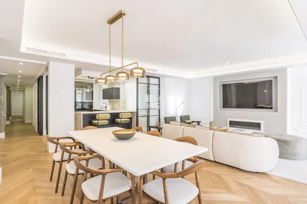 a dining room with furniture and wooden floor