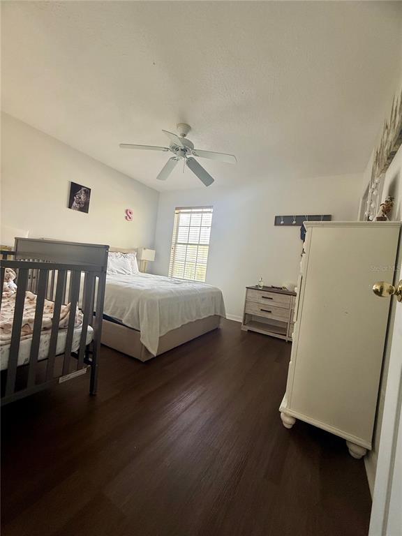 1008 Royal Ridge Drive Davenport, FL 33896 - Photo 11 of 19 a bedroom with a bed and a window