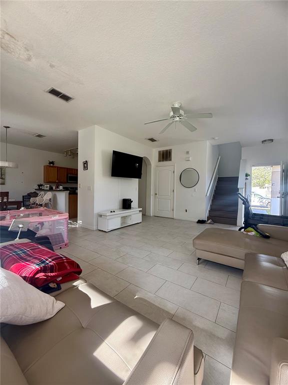 1008 Royal Ridge Drive Davenport, FL 33896 - Photo 6 of 19 a room with furniture and a flat screen tv