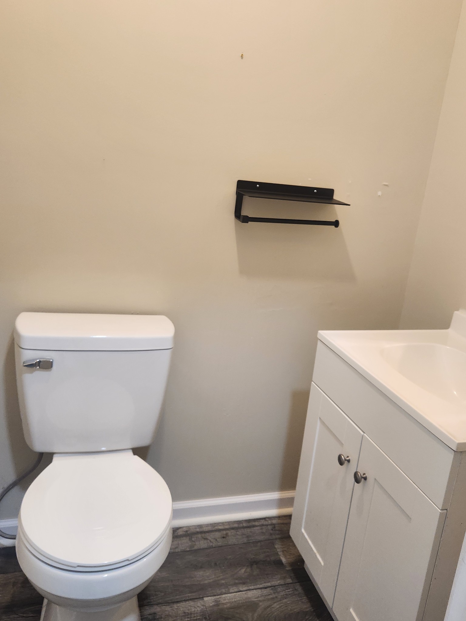 404 East College Street Dickson, TN 37055 - Photo 3 of 8 a white toilet sitting next to a shower