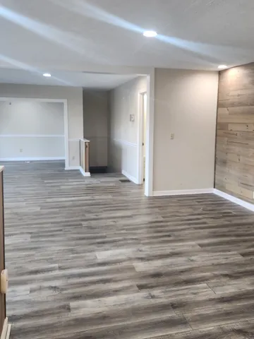 a view of a livingroom with wooden floor