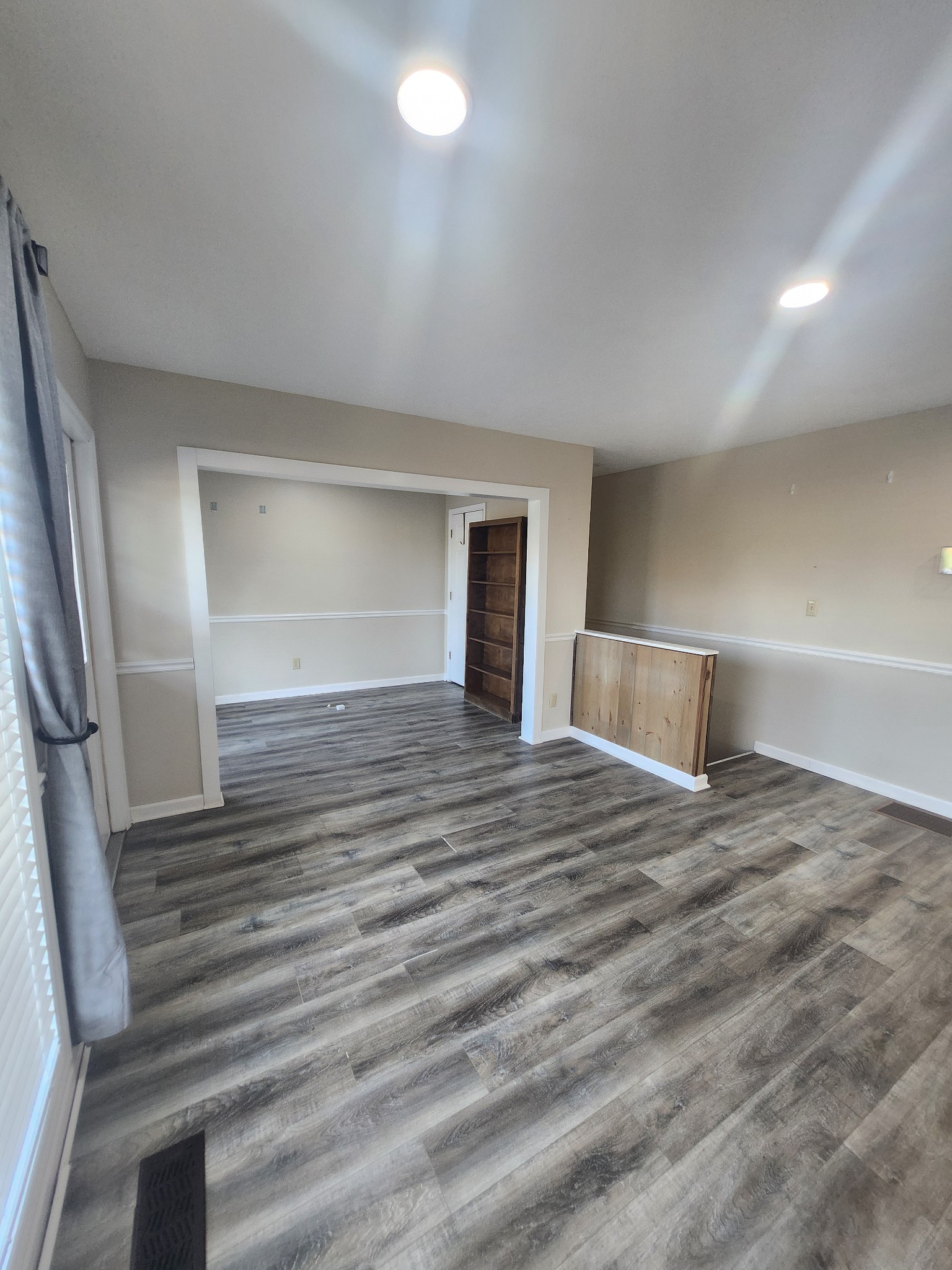404 East College Street Dickson, TN 37055 - Photo 6 of 8 a view of empty room with wooden floor and fan