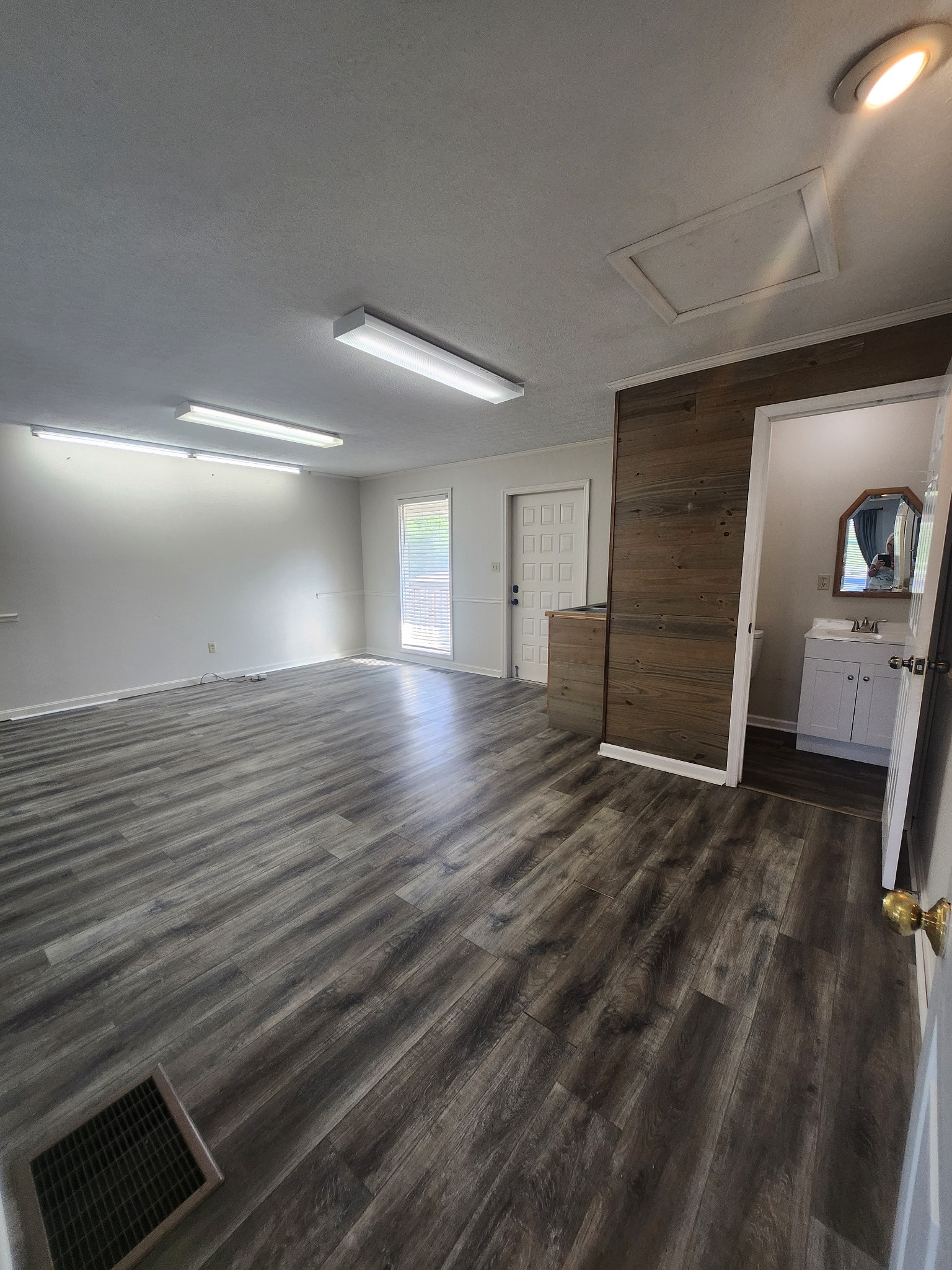 404 East College Street Dickson, TN 37055 - Photo 7 of 8 a view of empty room with wooden floor