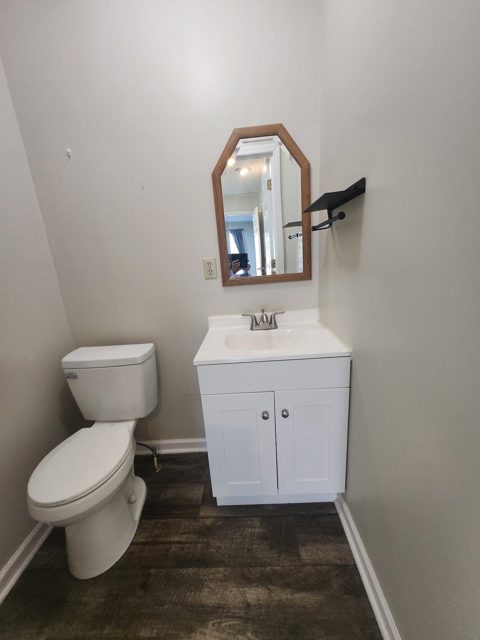 404 East College Street Dickson, TN 37055 - Photo 8 of 8 a bathroom with a toilet sink and mirror