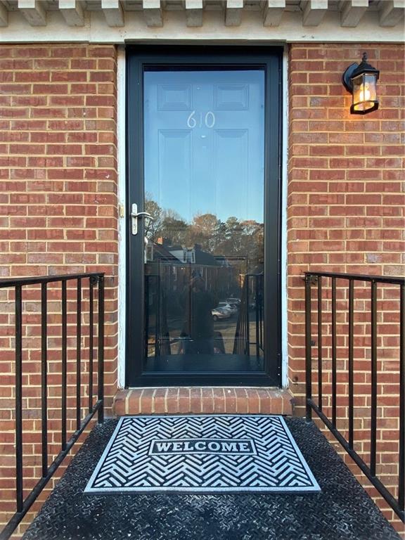 1166 Booth Road Southwest, Unit 610 Marietta, GA 30008 - Photo 17 of 20 a view of a brick house with a door